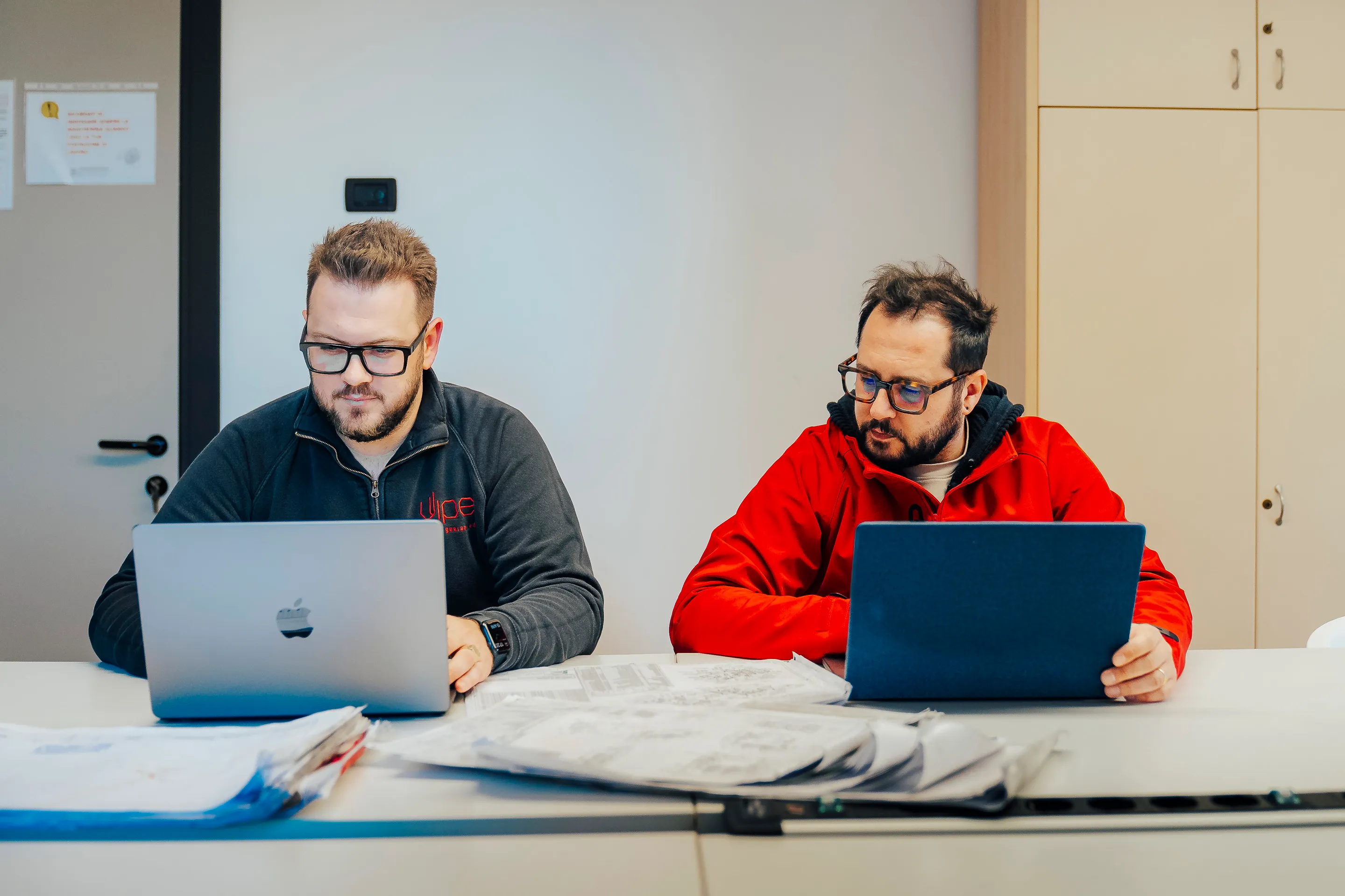 Oil and gas plant designers around a table